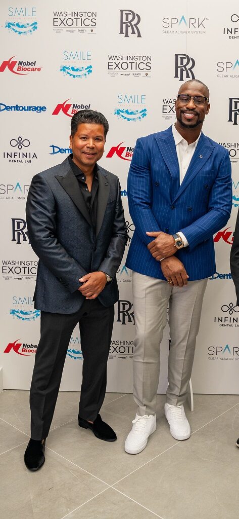 Two men posing at an event.