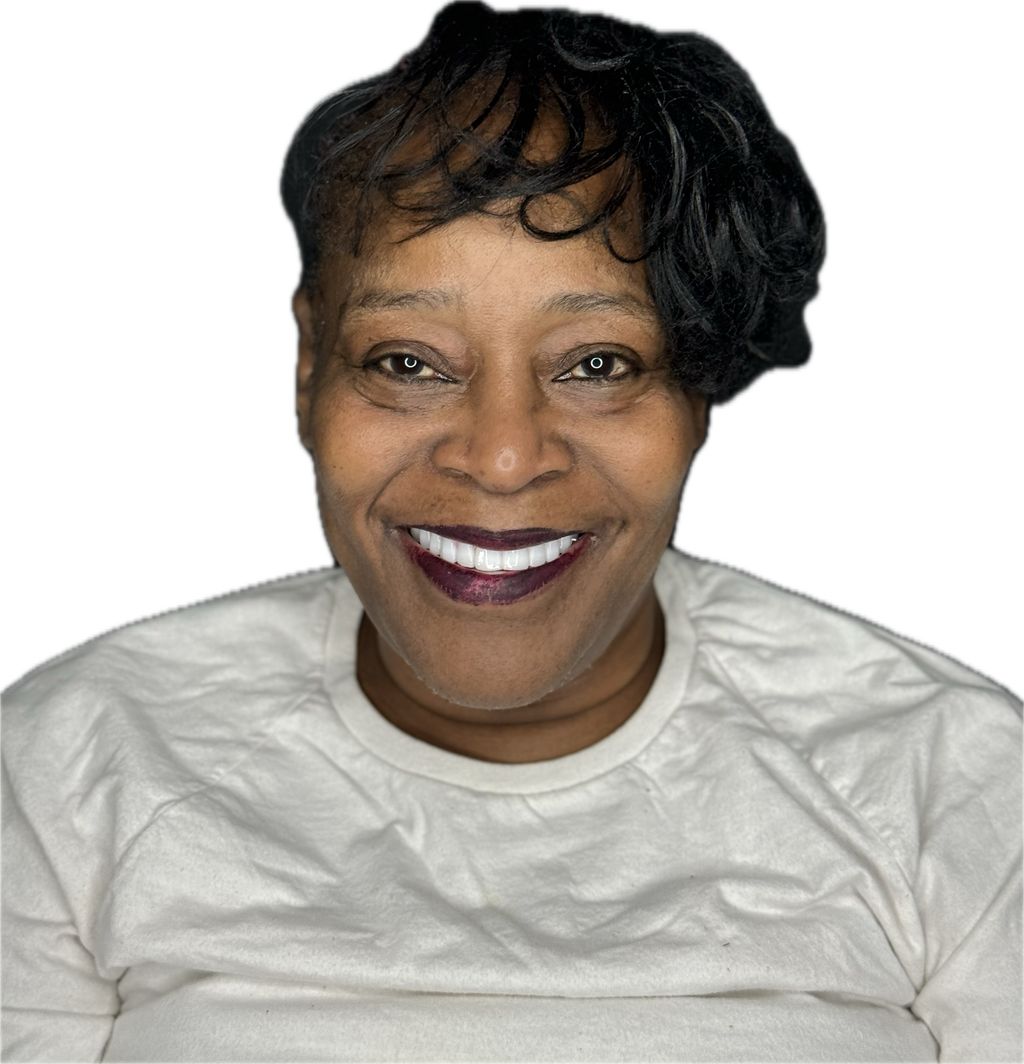 Smiling woman in white shirt, black hair.